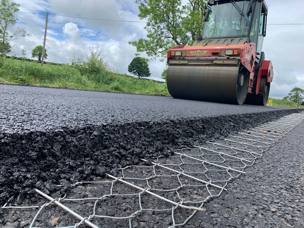 road design-engineers rolling tar